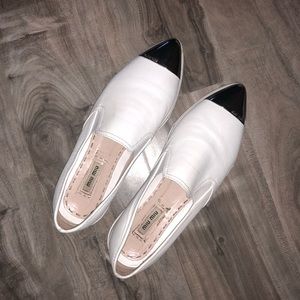 MIU MIU WHITE SLIP ONS. KENDALL JENNER